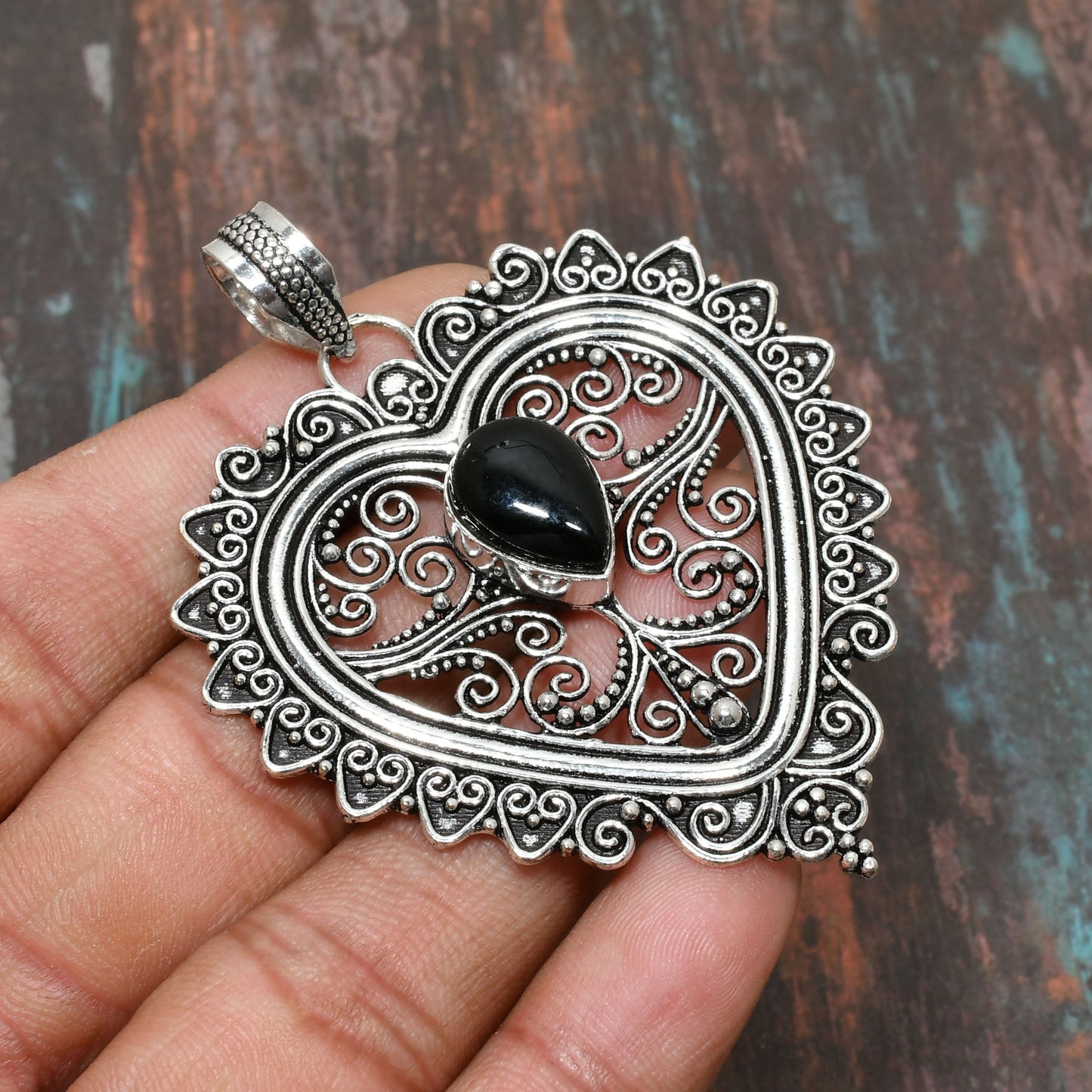 Heart’s Embrace – Black Onyx Sterling Silver Heart Pendant