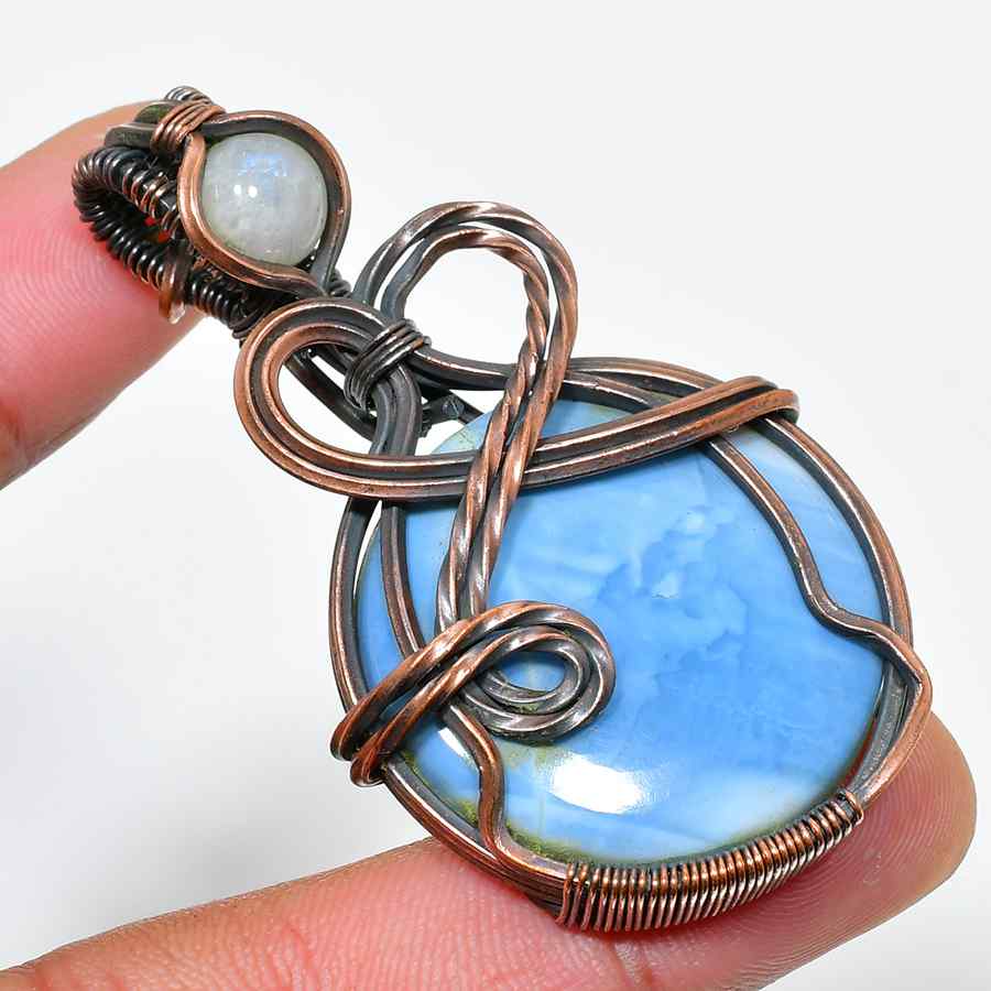 Serenity’s Embrace – Blue Lace Agate Copper Pendant