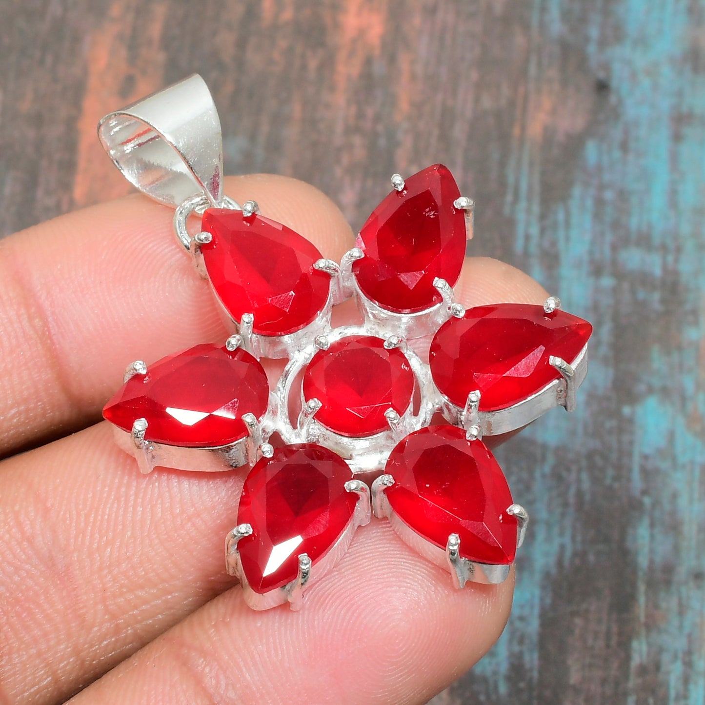 Ember’s Blossom – Ruby & Silver Pendant