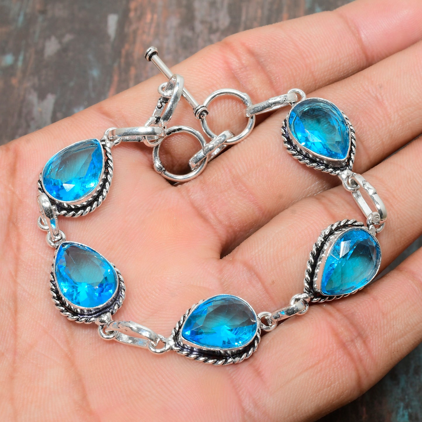 Ocean’s Embrace – Blue Topaz & Sterling Silver Bracelet