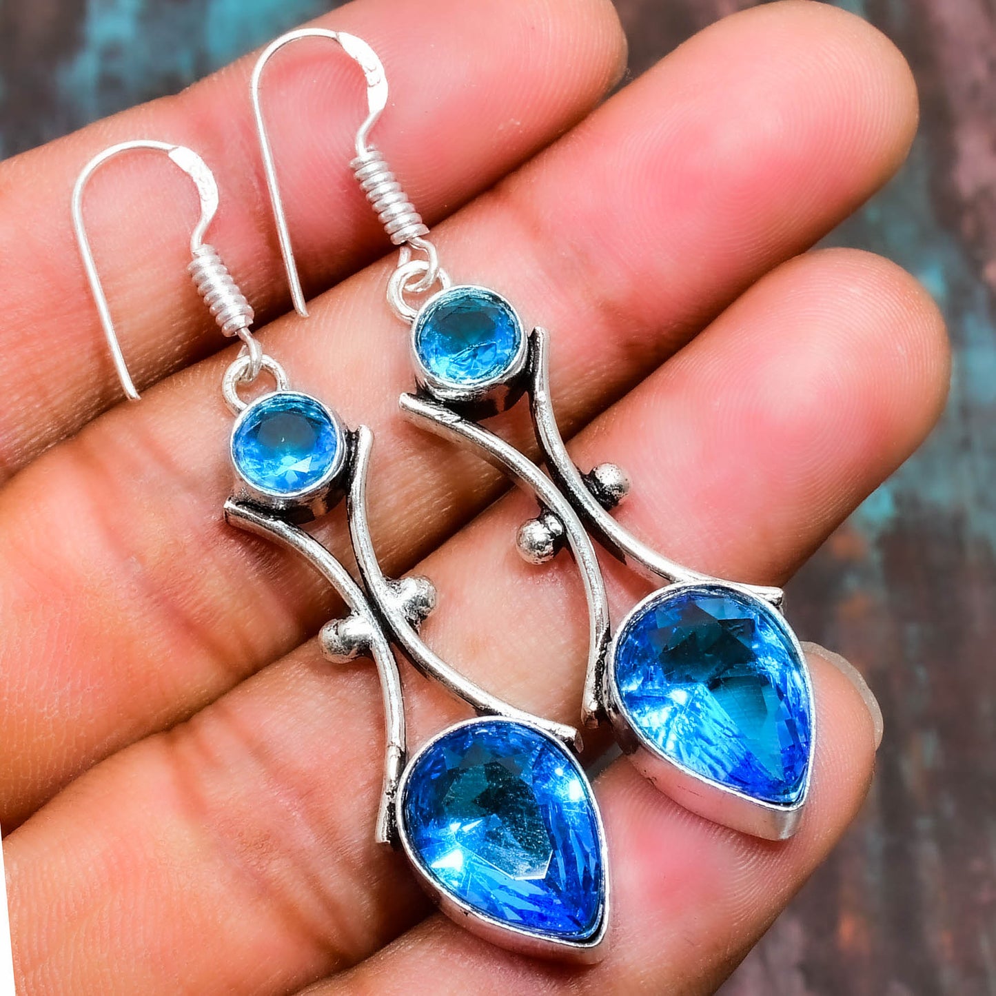 Ocean’s Embrace – Sterling Silver Blue Topaz Earrings