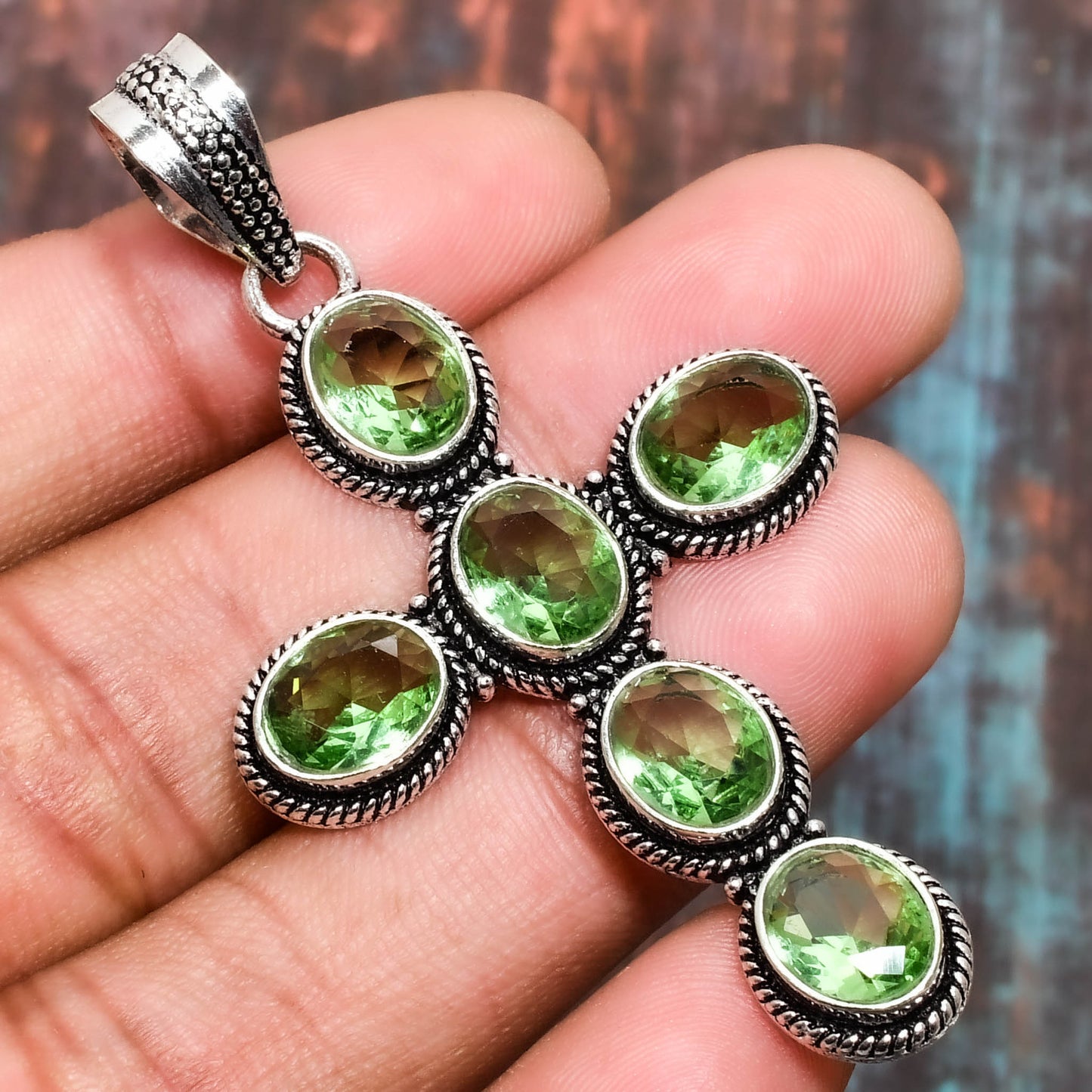 Verdant Renewal – Peridot Silver Cross