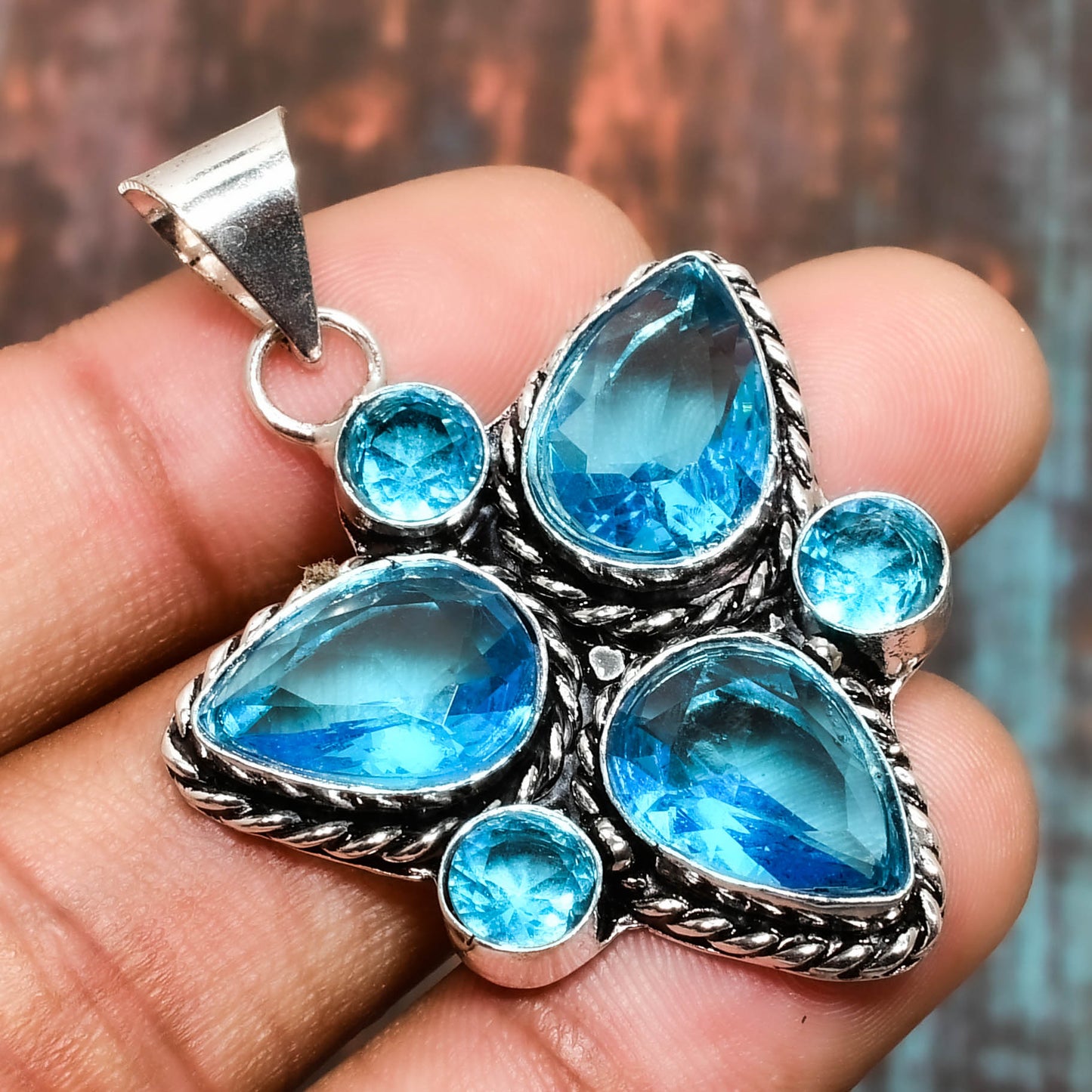 Azure Bloom – Blue Topaz & Sterling Silver Pendant