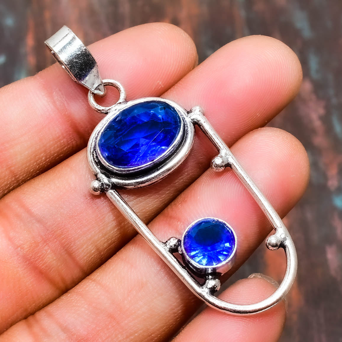 Ocean’s Embrace – Silver Blue Topaz Pendant