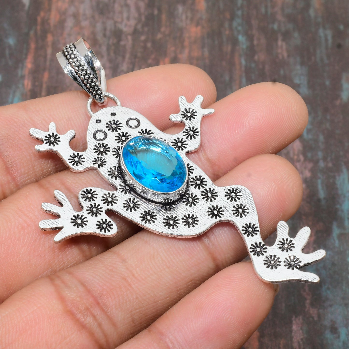 Ember’s Leap – Blue Topaz Sterling Silver Frog Pendant