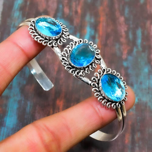 Serene Waves – Blue Topaz Silver Cuff