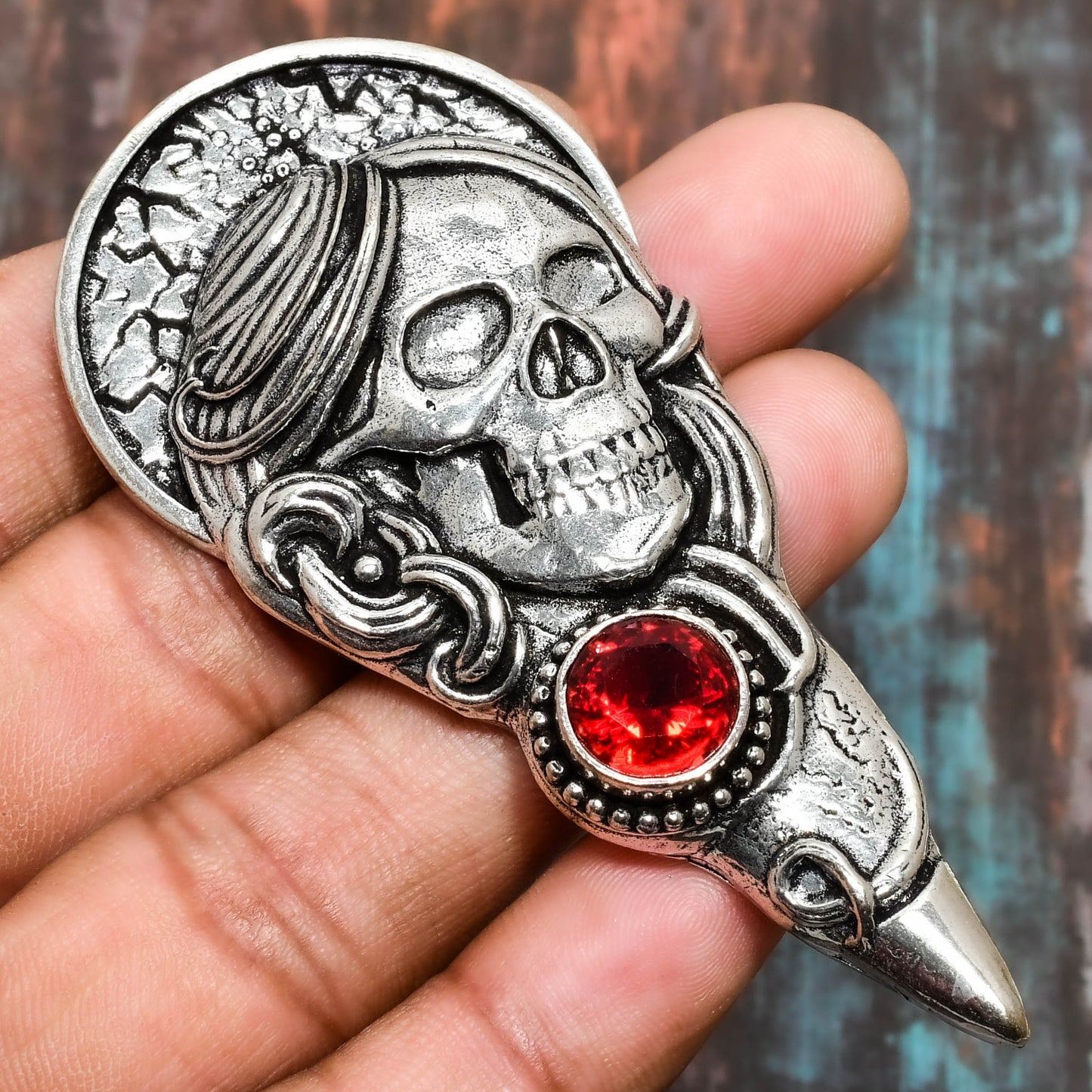 Raven’s Embrace – Red Gem Skull Brooch