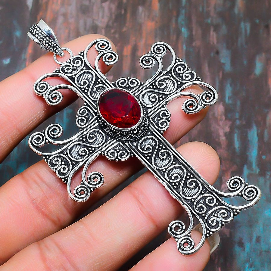 Ruby Valor – Handcrafted Metal Cross Pendant