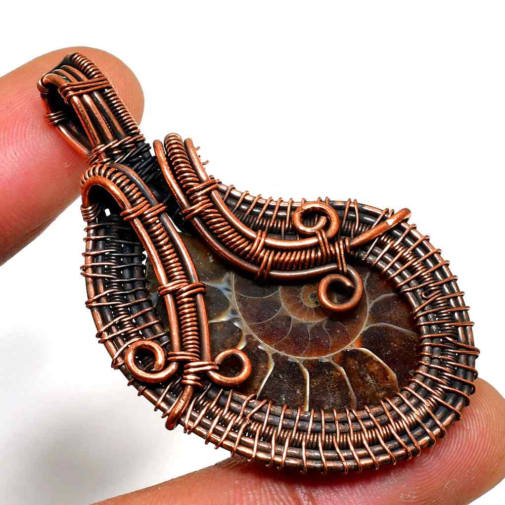 Earth’s Embrace – Copper-Wrapped Fossil Pendant