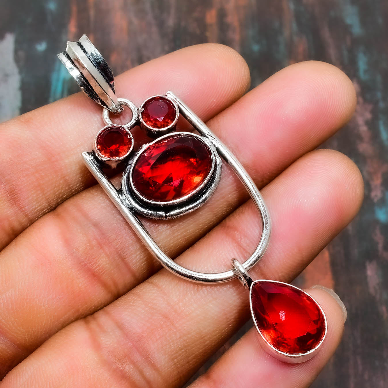 Passion’s Embrace – Red Gemstone Silver Pendant