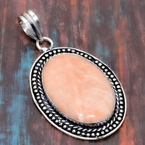Serenity’s Embrace – Peach Moonstone Sterling Silver Pendant