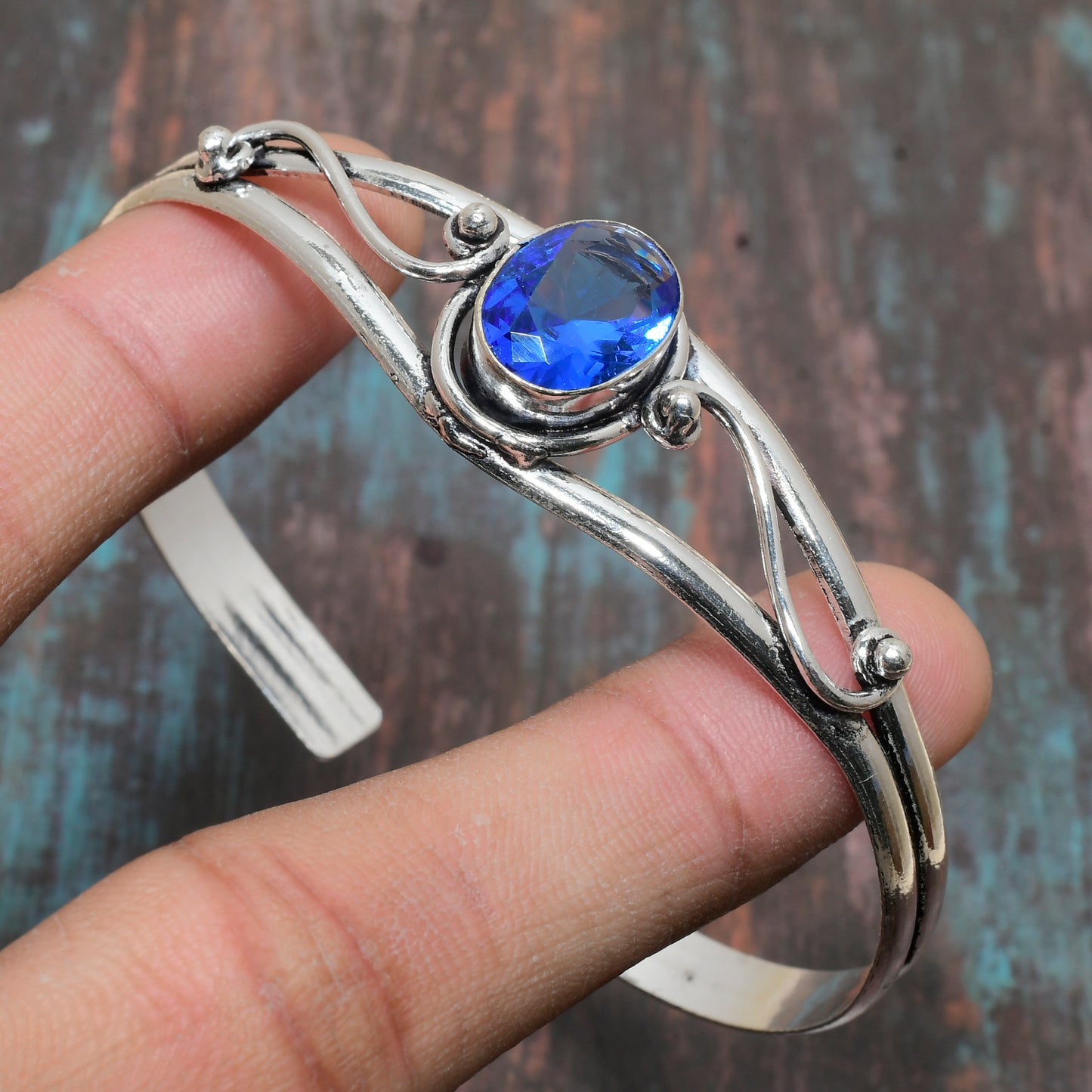 Ocean’s Embrace – Blue Topaz Silver Bangle