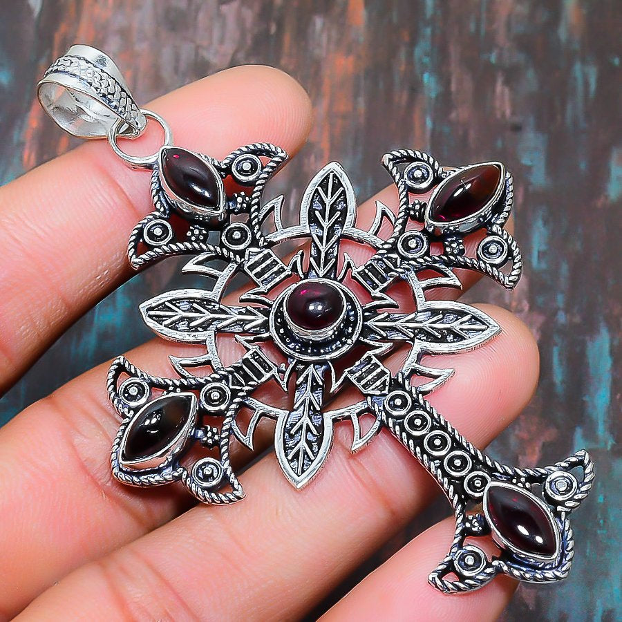 Ember’s Faith – Sterling Silver Garnet Cross Pendant