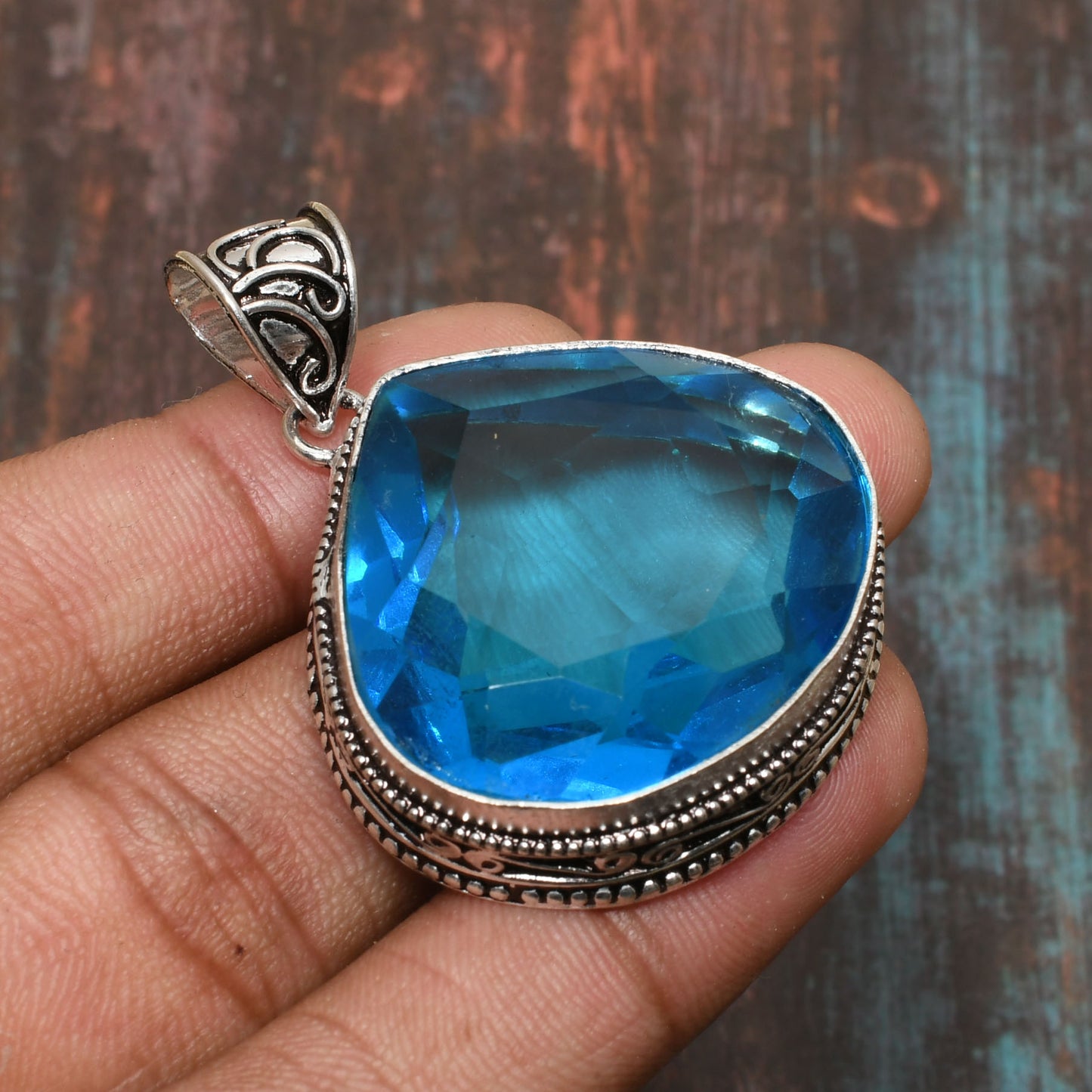 Ocean’s Whisper – Blue Topaz Sterling Silver Pendant