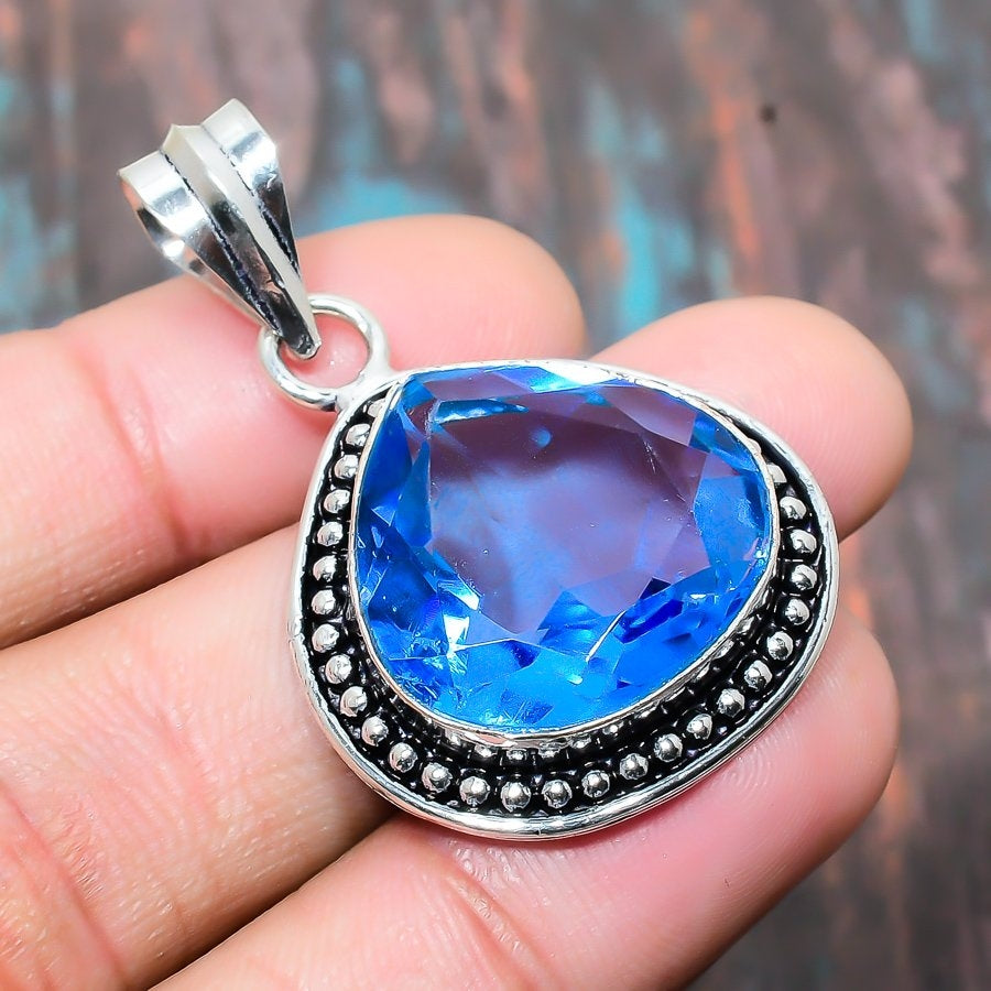 Celestial Blue Charm – Sterling Silver Blue Topaz Pendant