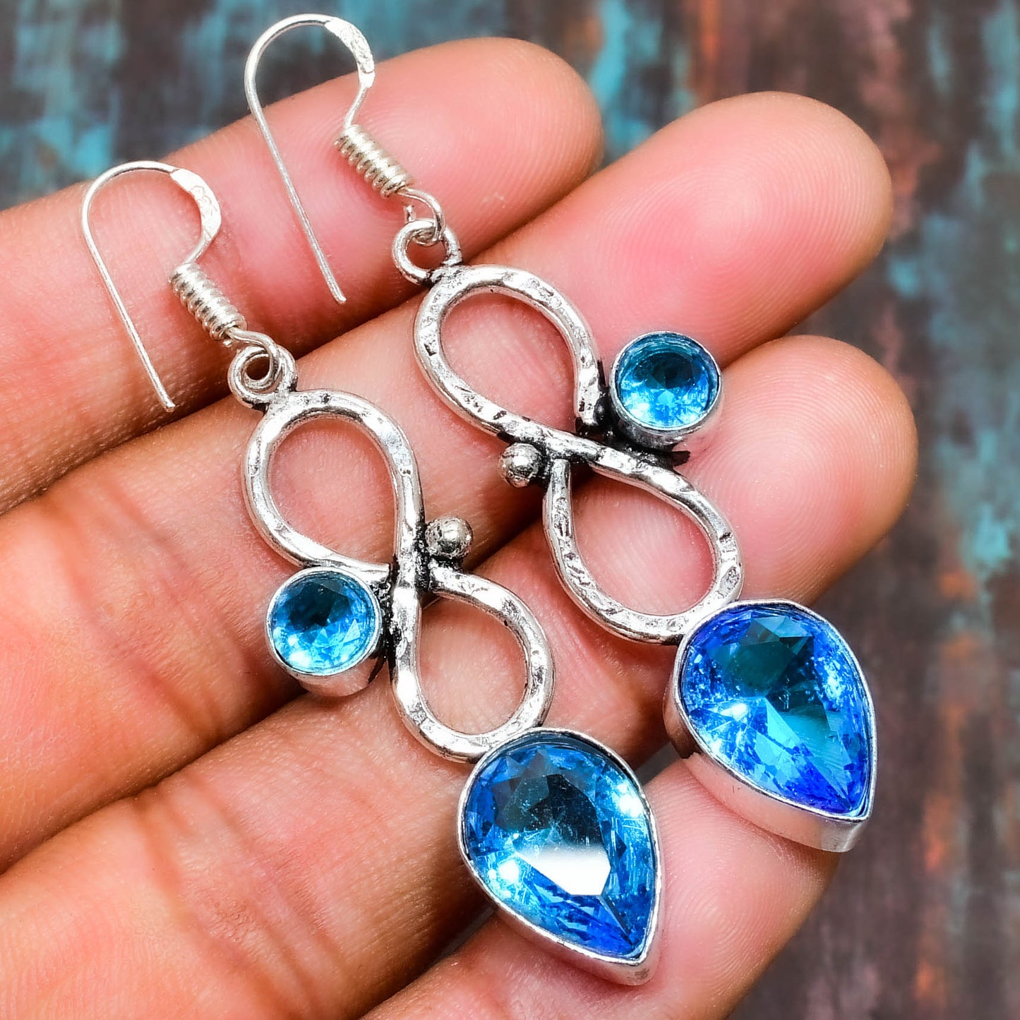 Infinite Elegance – Blue Topaz Silver Earrings