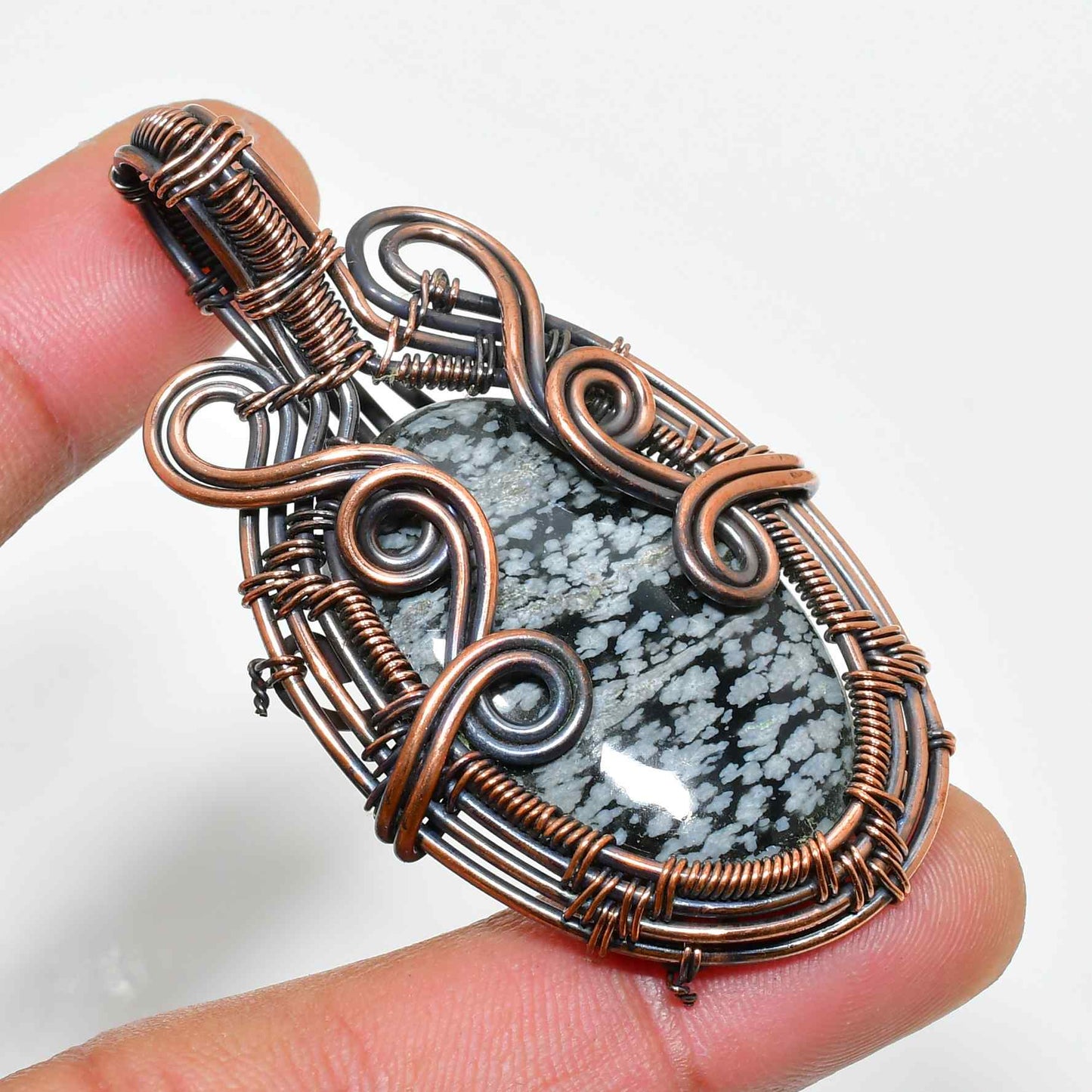 Ember’s Embrace – Black Stone & Copper Pendant