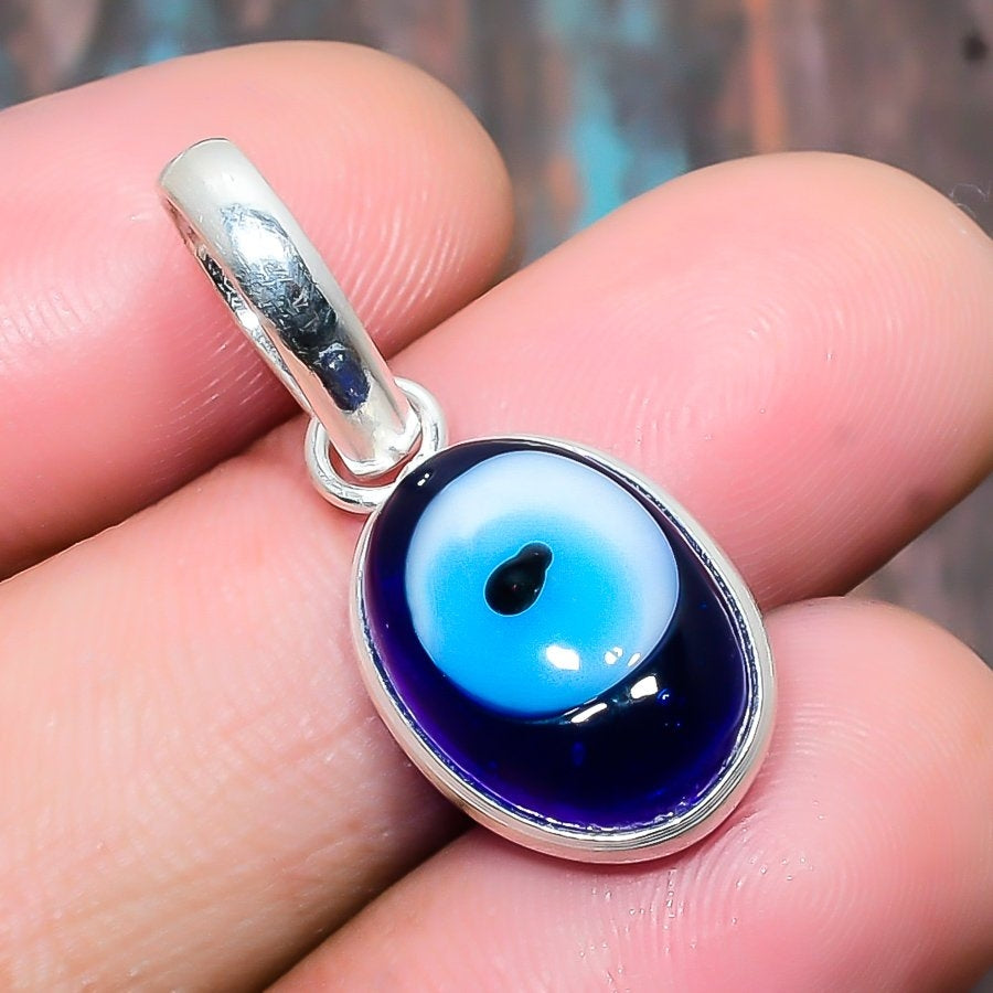 Mira’s Gaze – Blue Glass & Silver Evil Eye Pendant