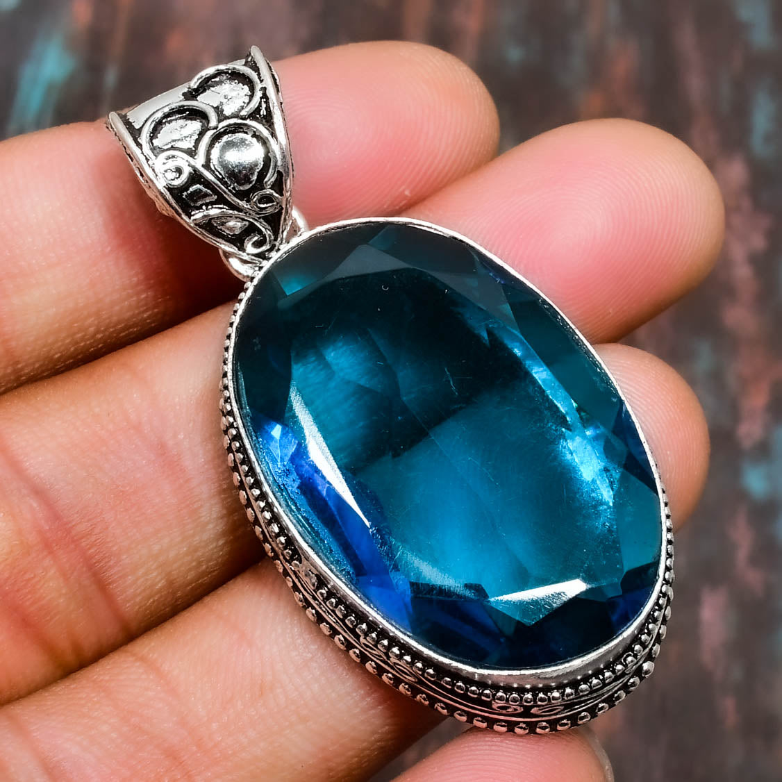 Ocean’s Embrace – Blue Topaz Sterling Silver Pendant
