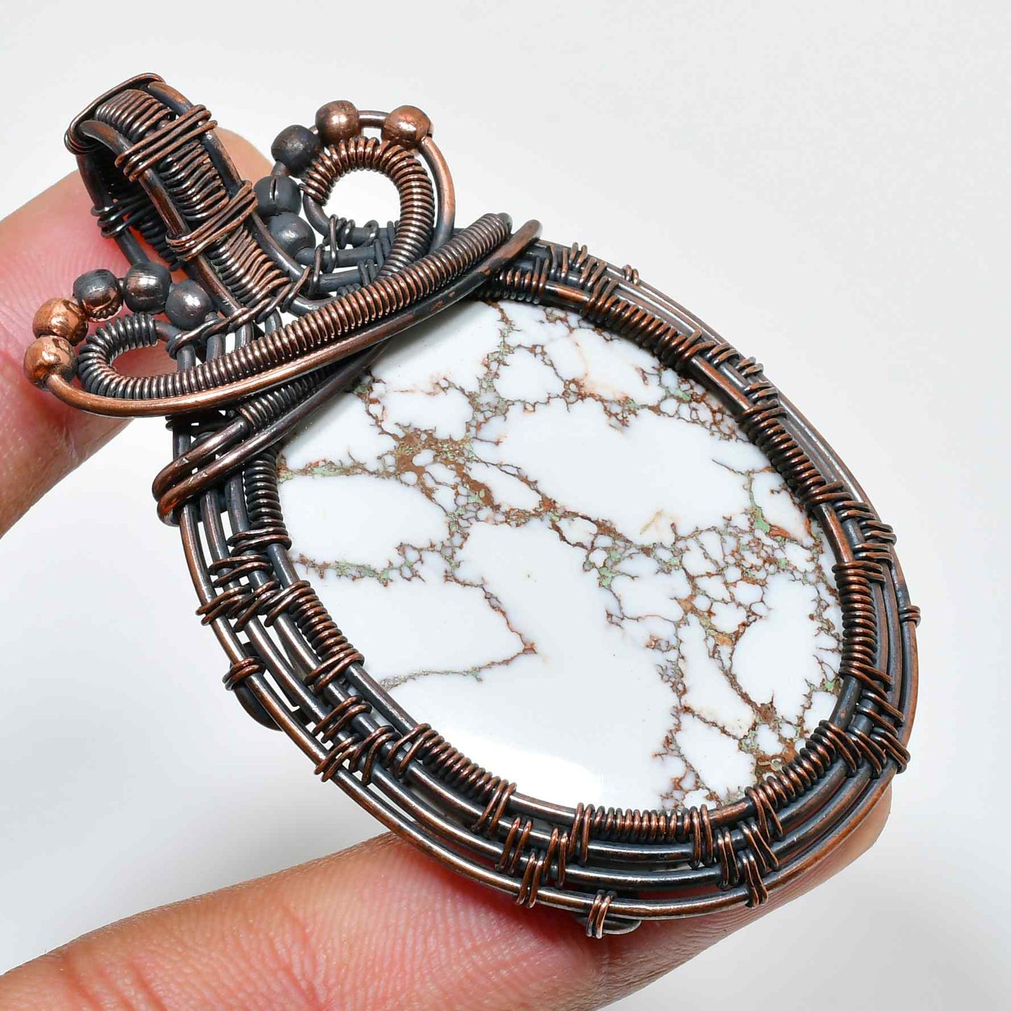 Serenity’s Embrace – White Howlite Copper Pendant
