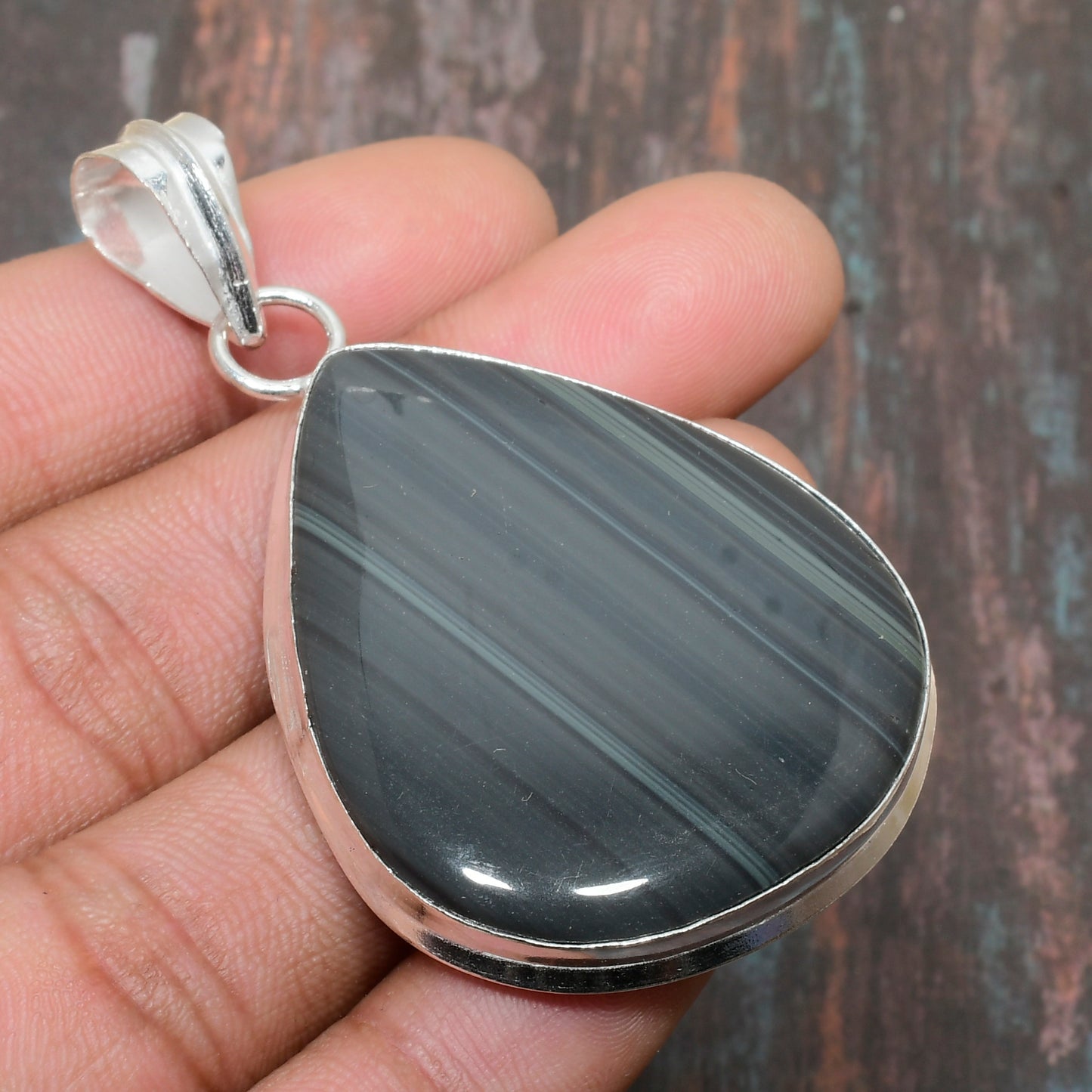 Earth’s Embrace – Striped Agate Sterling Silver Pendant