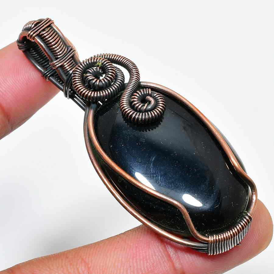 Ember’s Touch – Black Stone Copper Pendant