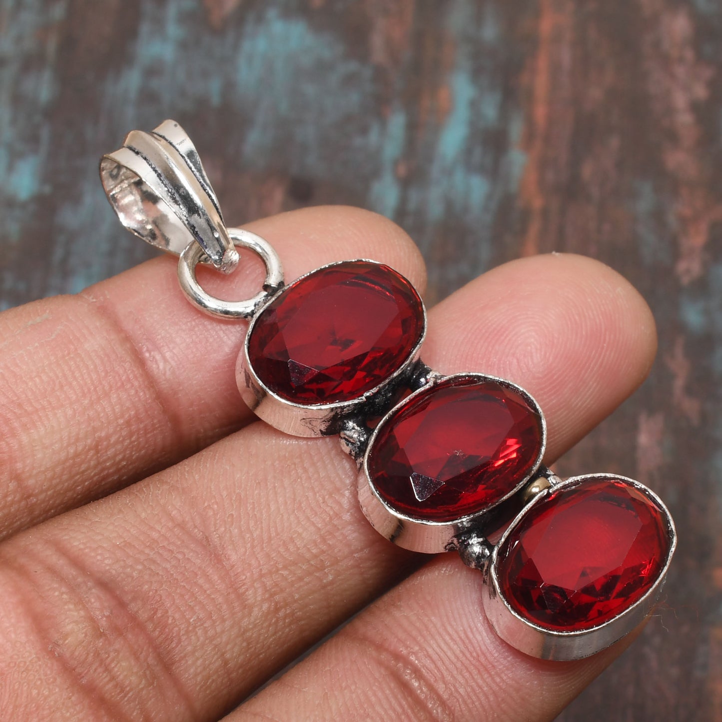 Passion’s Flame – Ruby Trio Silver Pendant