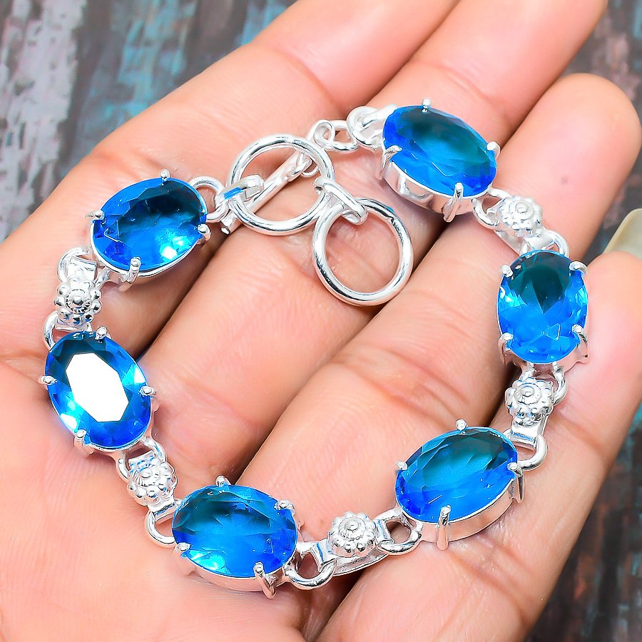 Ocean’s Whisper – Sterling Silver Blue Topaz Bracelet