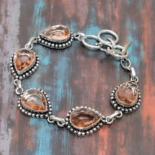 Serenity’s Bloom – Rose Quartz & Silver Charm Bracelet