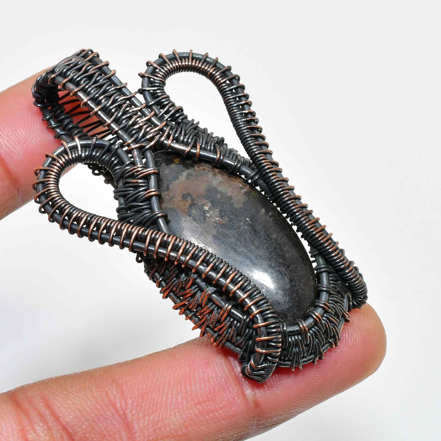 Shadowstone Embrace – Oxidized Copper Pendant