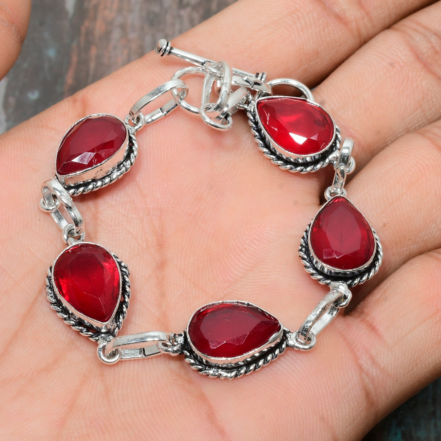 Ruby Radiance – Twisted Silver Bracelet