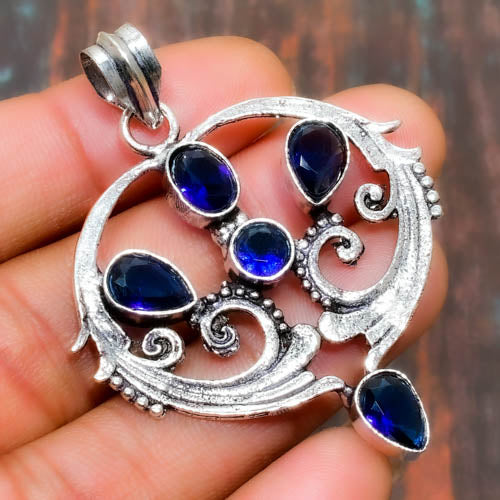 Celestial Harmony – Blue Topaz & Polished Silver Pendant