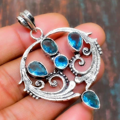 Celeste’s Embrace – Blue Topaz Silver Filigree Pendant