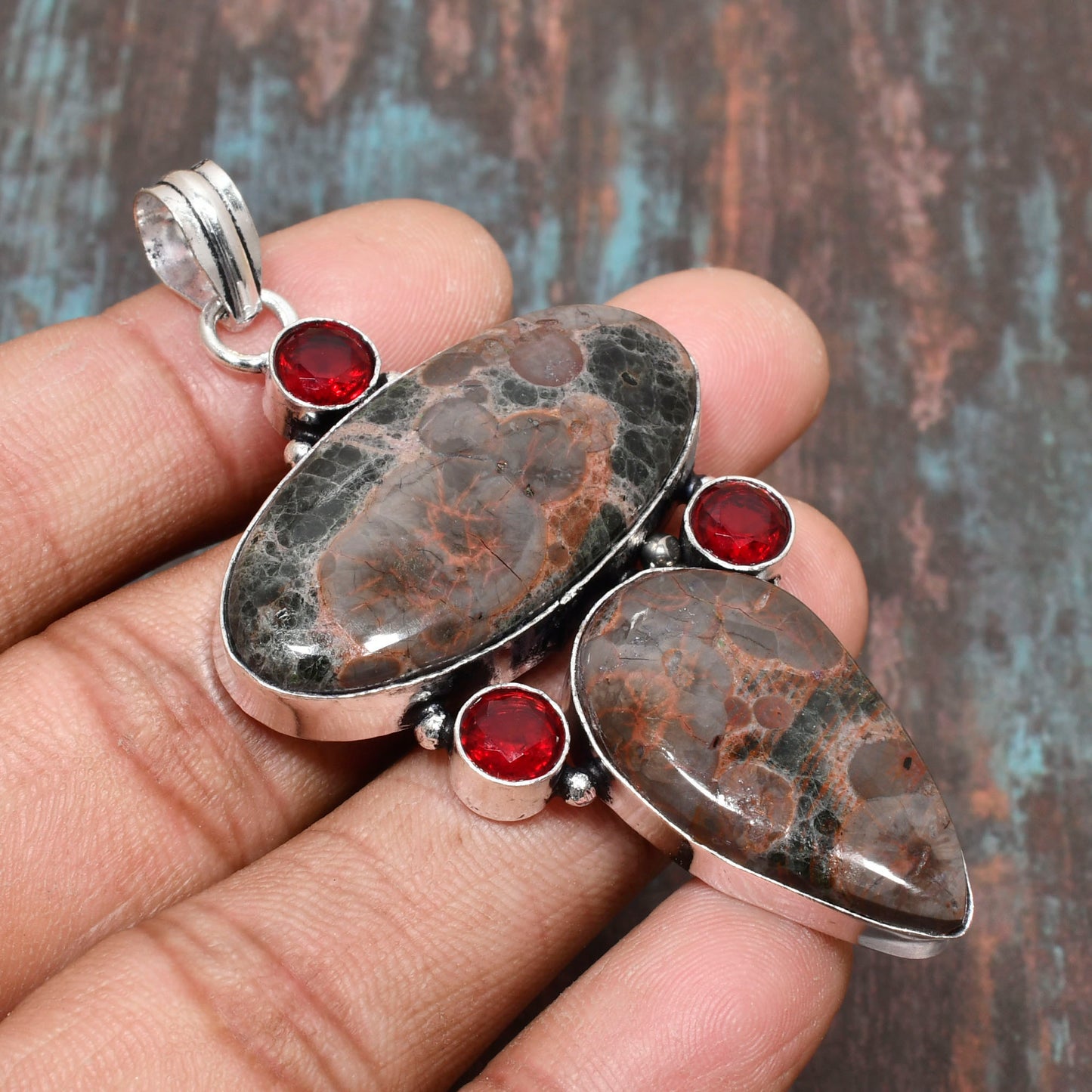 Ember’s Embrace – Garnet Silver Pendant