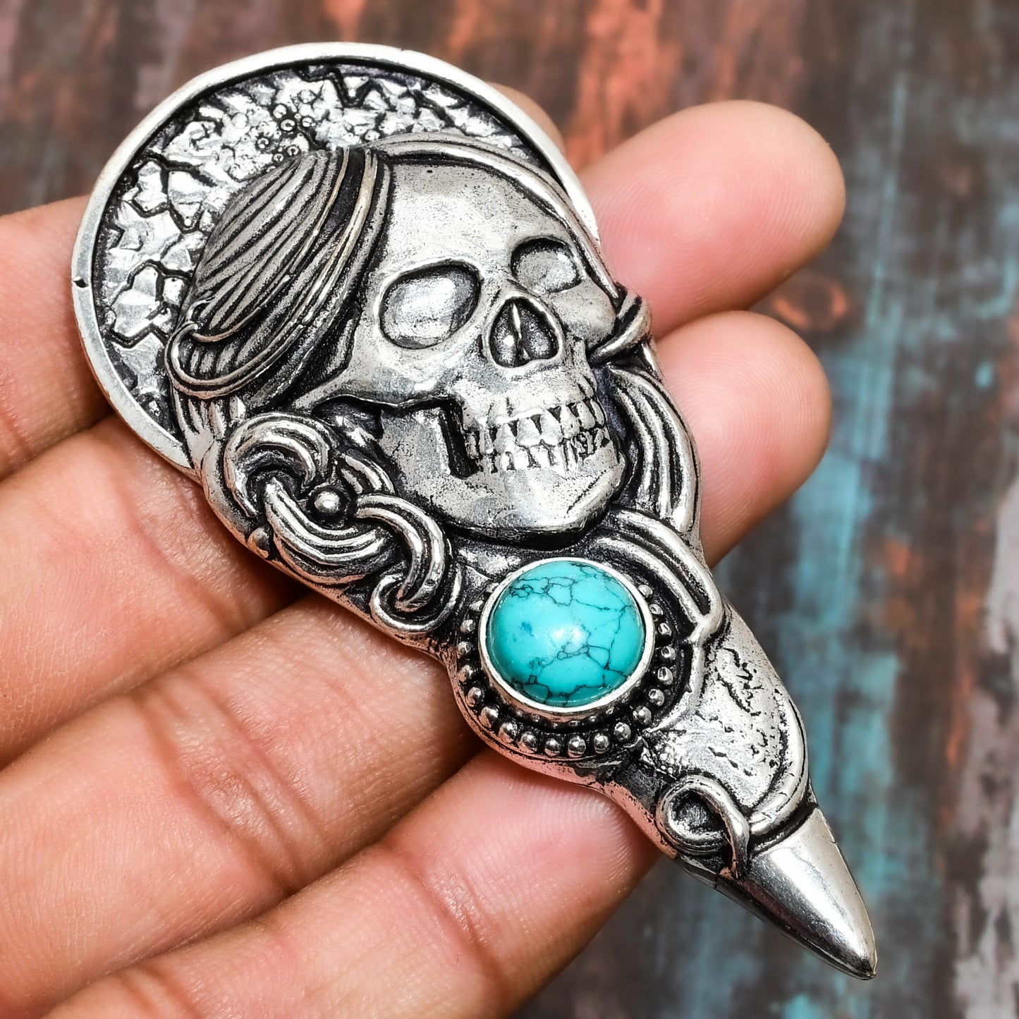 Raven’s Emblem – Turquoise Skull Pendant