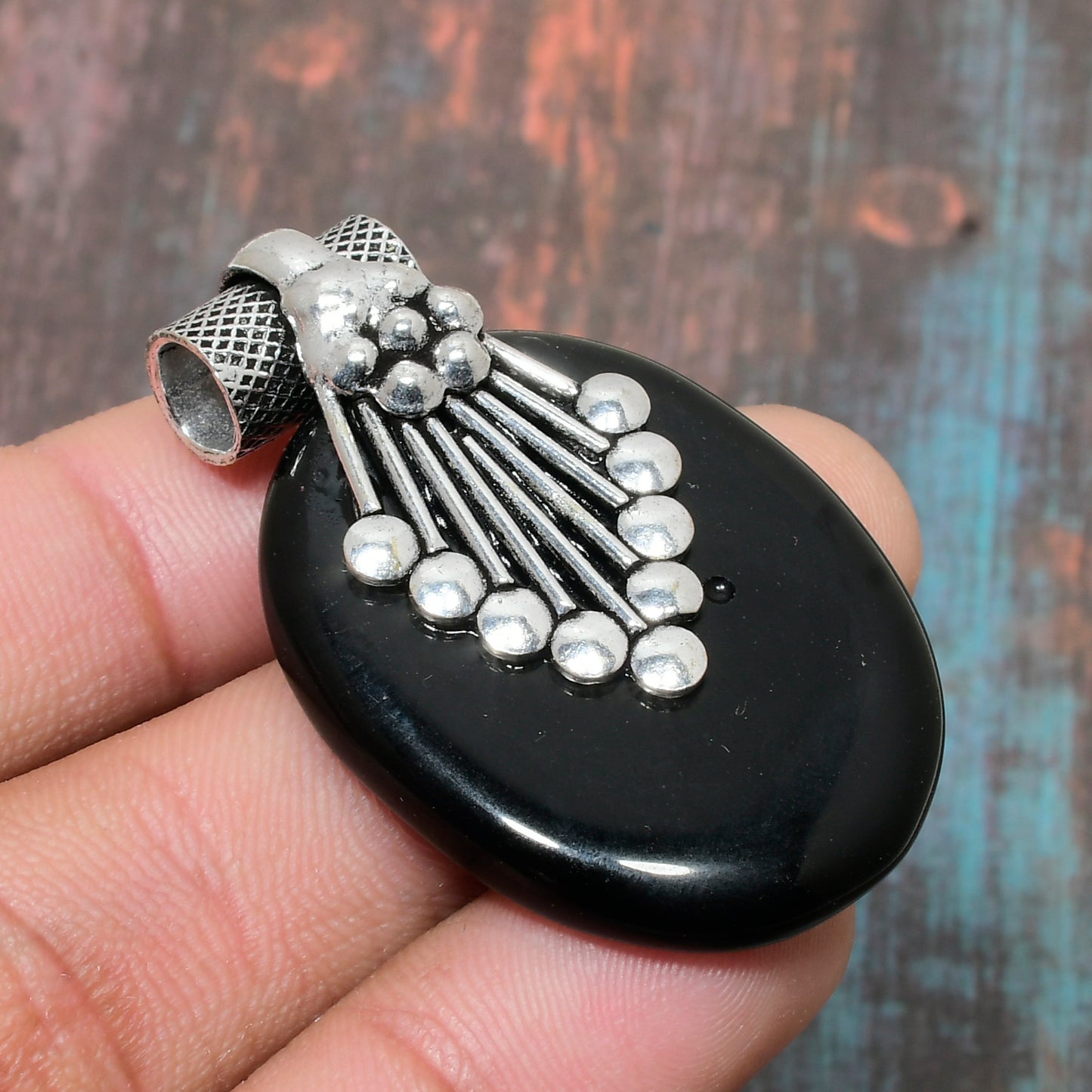 Raven’s Embrace – Onyx & Silver Pendant