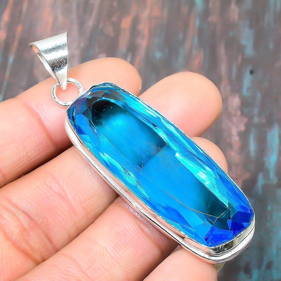 Aurora’s Gleam – Sterling Silver Blue Topaz Pendant