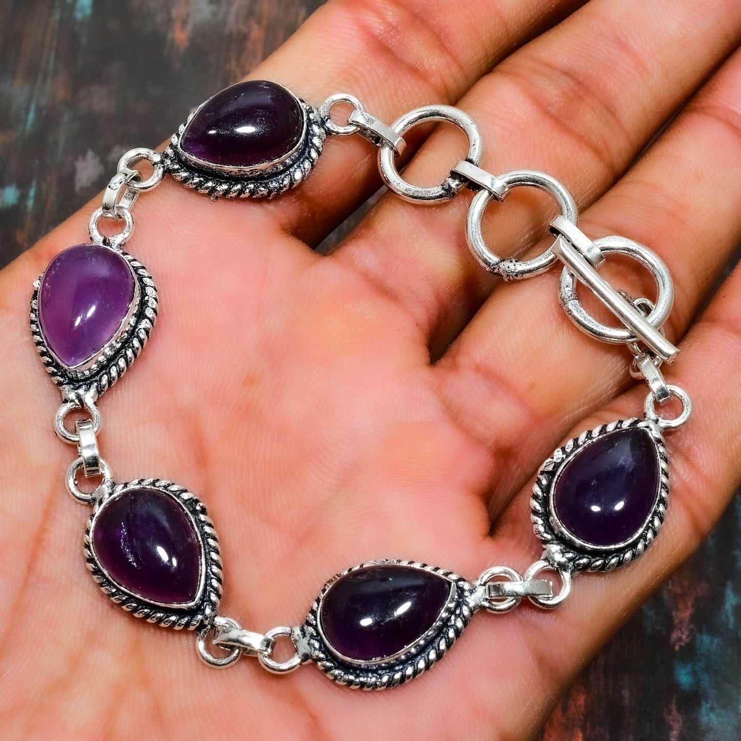Elara’s Serenity – Amethyst Charm Bracelet