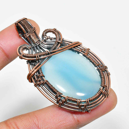 Serenity’s Embrace – Blue Lace Agate Copper Pendant