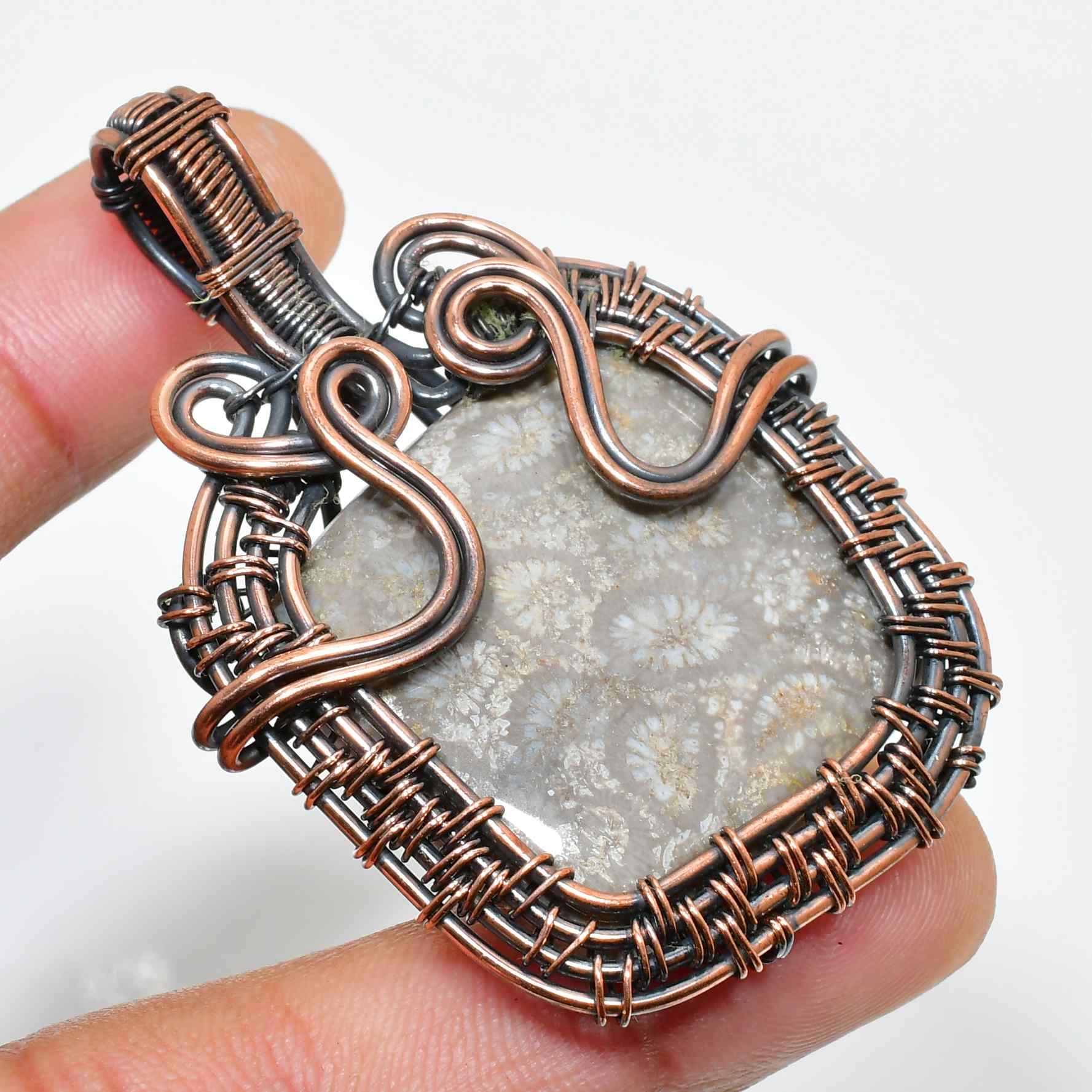 Serpent’s Embrace – Oxidized Copper & Silver Fossil Pendant