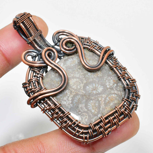 Serpent’s Embrace – Oxidized Copper & Silver Fossil Pendant