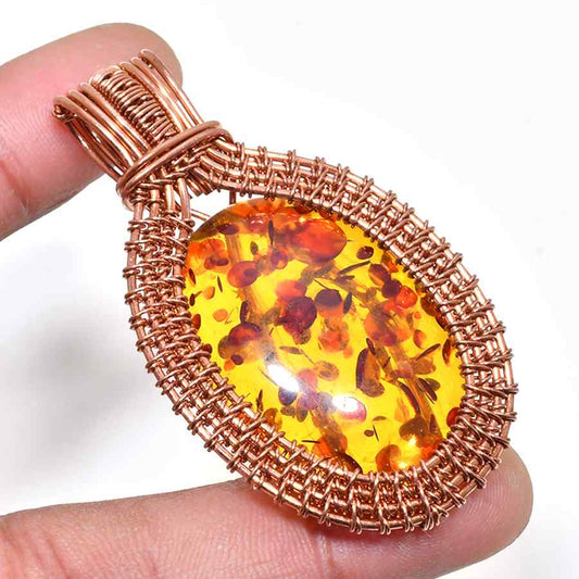 Amber Embrace – Handwoven Copper Pendant