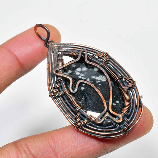 Dolphin’s Embrace – Black Stone & Oxidized Copper Pendant
