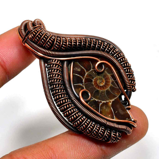 Terra’s Embrace – Fossilized Ammonite Copper Pendant