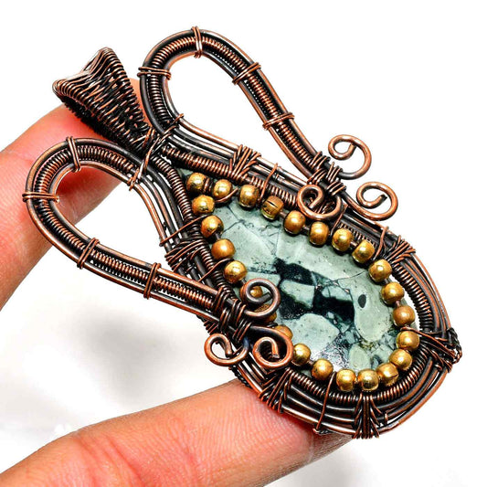 Terra’s Whisper – Copper-Wrapped Raw Gemstone Pendant