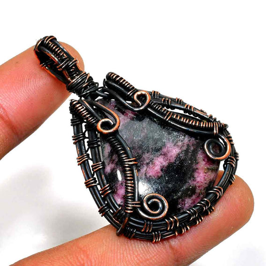 Harmonia’s Embrace – Rhodonite Copper Pendant