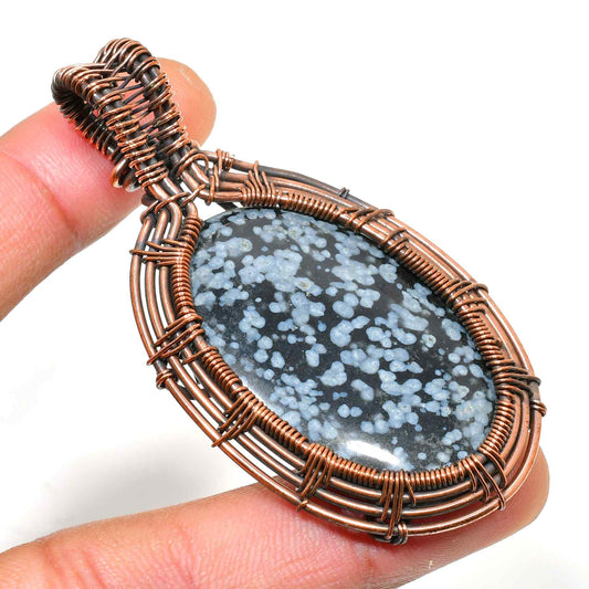 Eira’s Harmony – Snowflake Obsidian Copper Pendant