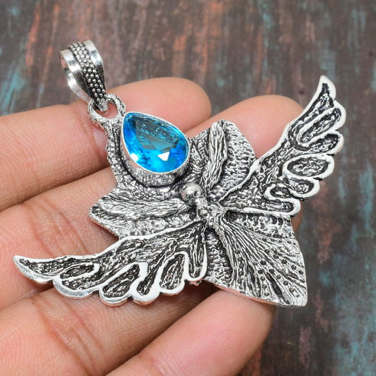 Celestial Whisper – Blue Topaz & Silver Butterfly Pendant