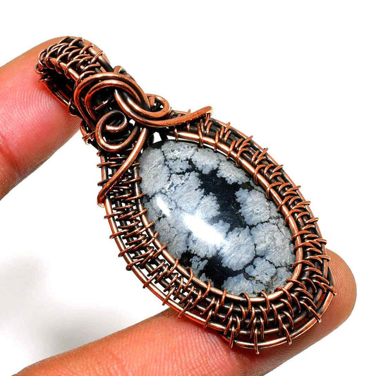 Terra’s Embrace – Snowflake Obsidian Copper Pendant