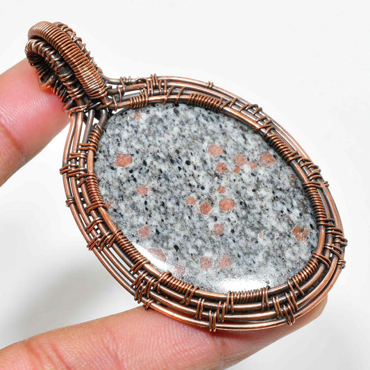 Garnet’s Embrace – Copper-Wrapped Garnet Pendant